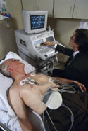 patient receiving echocardiogram, color photo